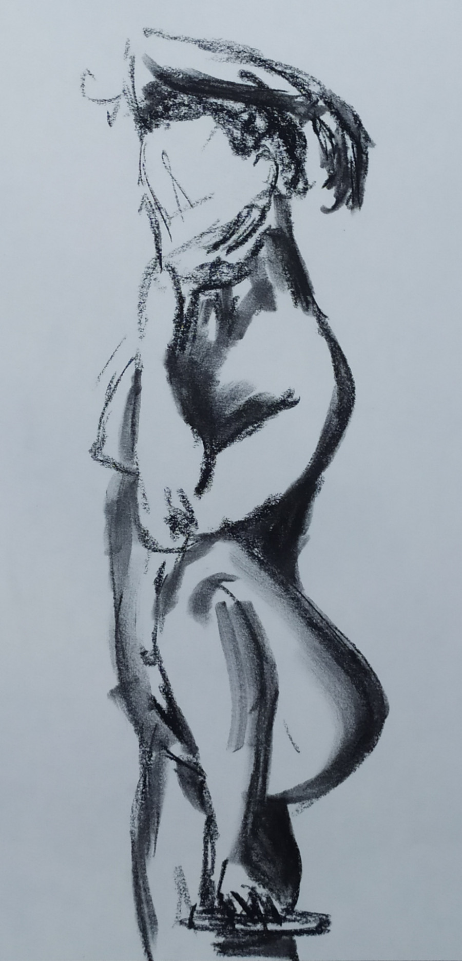 Woman standing, left foot up on stool right arm thrown over head, chin on left hand, left arm resting on drawn-up knee.