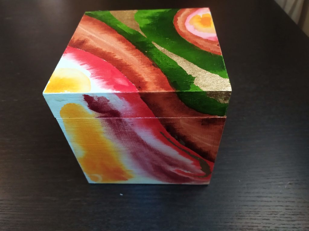 Box 04: wooden box decorated in coloured inks and gold leaf